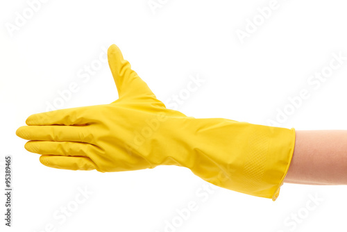 Close up of female hand in yellow protective rubber glove giving for handshake against white background