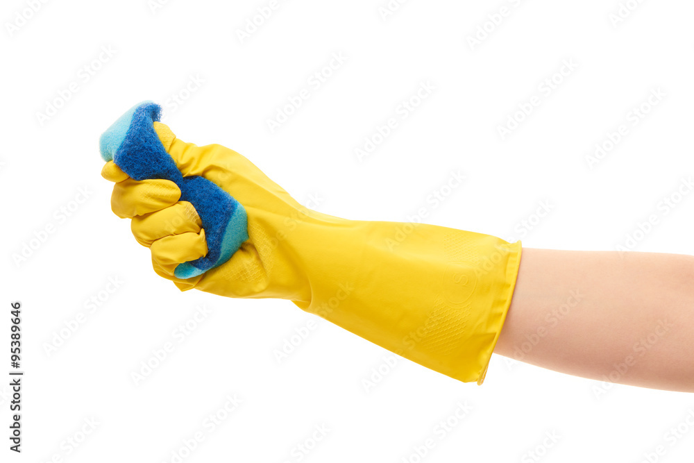Close up of female hand in yellow protective rubber glove squeezing blue cleaning sponge against white background Close up of female hand in yellow protective rubber glove squeezing blue cleaning sponge against white background