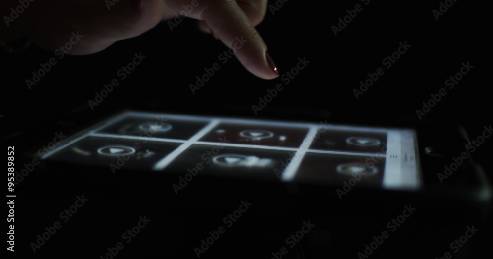 Closeup finger touching tablet computer touchscreen Closeup finger touching tablet computer touchscreen