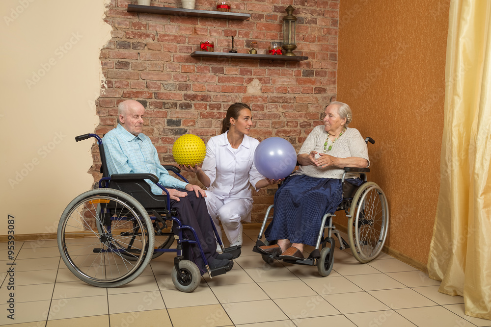 Obraz premium Two Senior In Wheelchairs During Physiotherapy