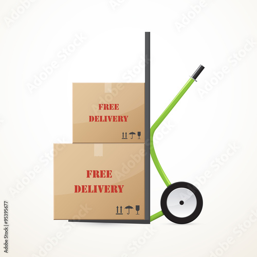 Cardboard boxes on the hand trolley. Free delivery.