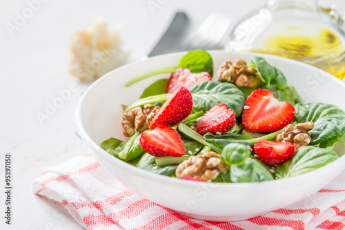 Strawberry salad in white bowl
