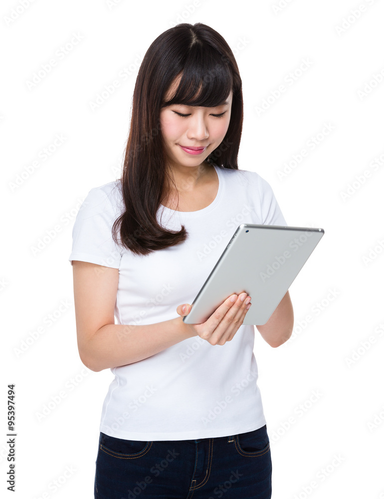 Asian Woman use of the tablet pc Asian Woman use of the tablet pc