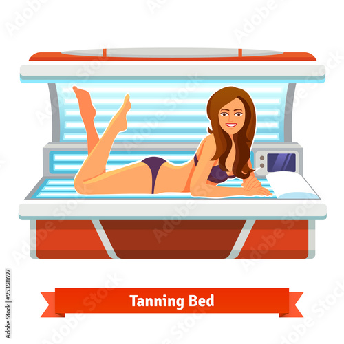 Young pretty woman in tanning bed. Artificial tan