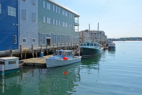 a row of fishing vessels anchored at the Holyoke Wharf, Portland Maine photo