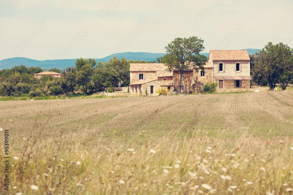 Stone house in a harvested field, France Stone house in a harvested field, France