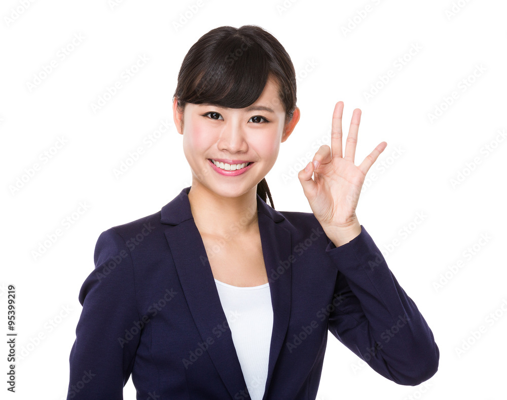 Businesswoman with ok sign gesture Businesswoman with ok sign gesture