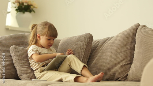 Girl lost in the game on the tablet, and she's mad