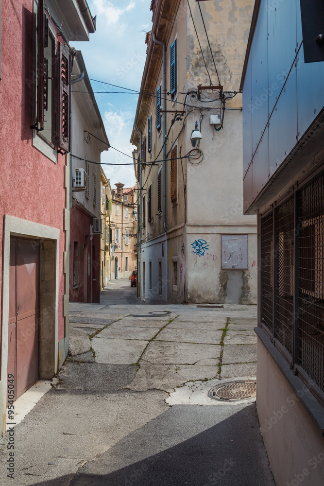 Koper, Slovenia - 19 september 2015. Small medieval deserted seaside European street.