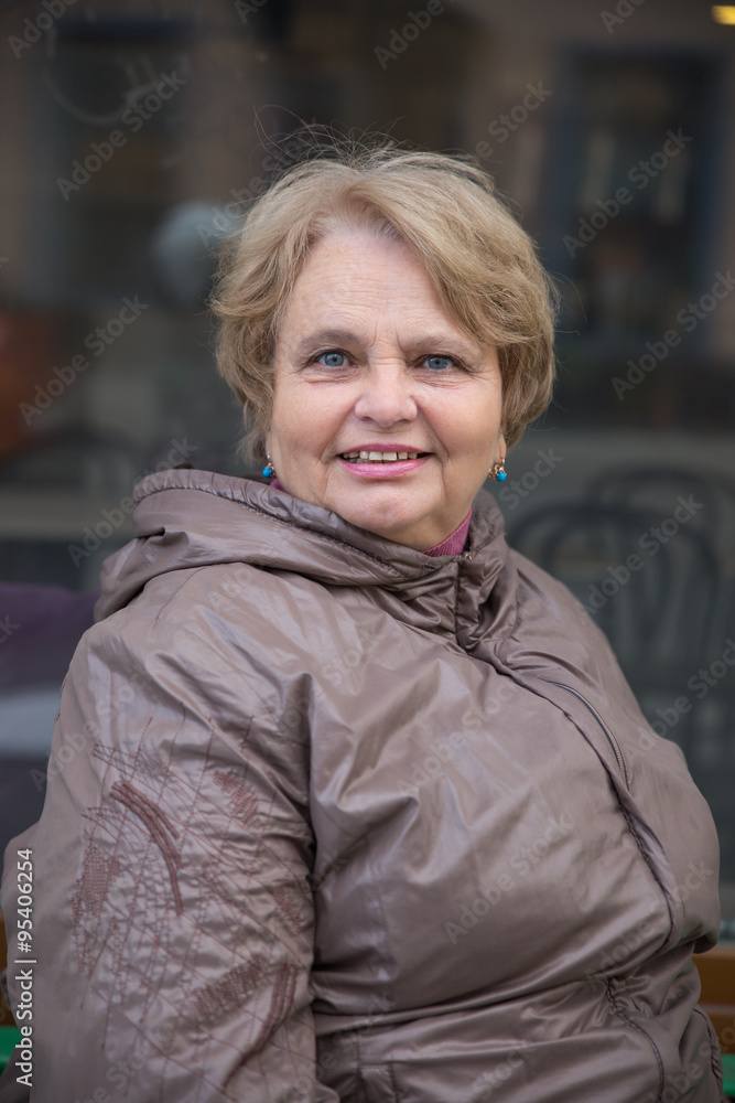 Old pensioner woman walking outside Old pensioner woman walking outside