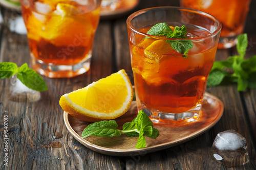 Glass of aperol with ice, orange and mint