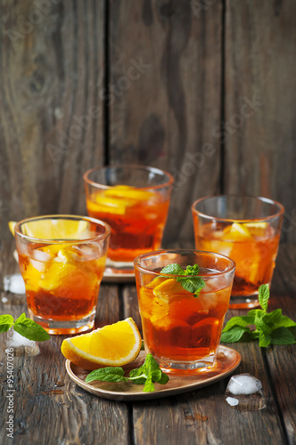 Glass of aperol with ice, orange and mint