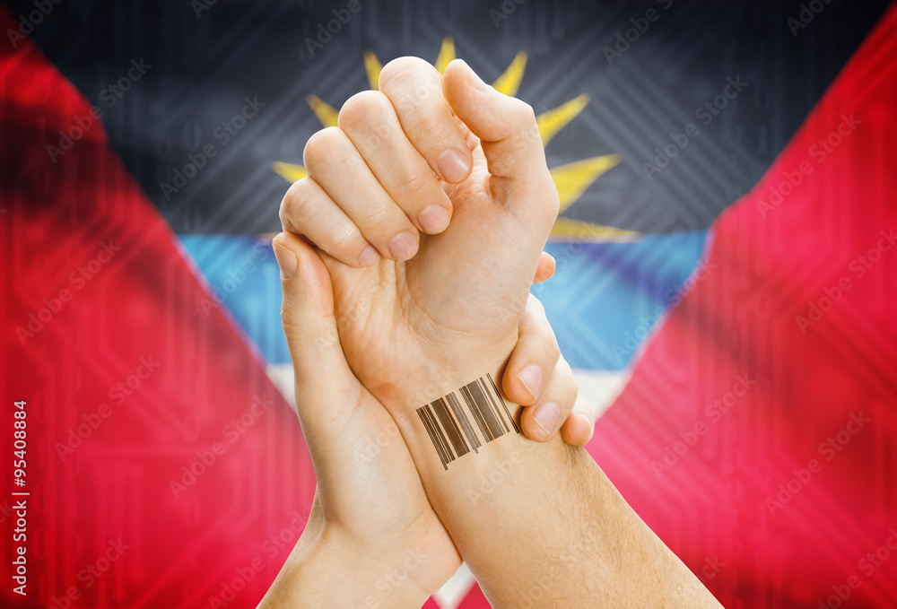 Barcode ID number on wrist and national flag on background - Antigua and Barbuda
