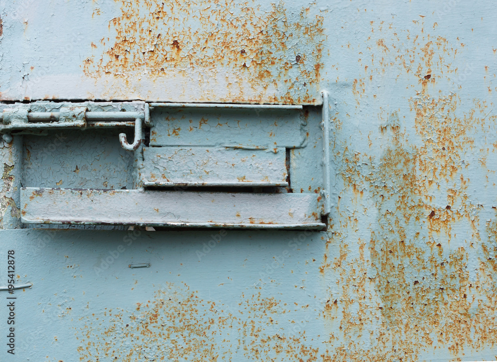 Naklejka premium The bolt on the old iron door.