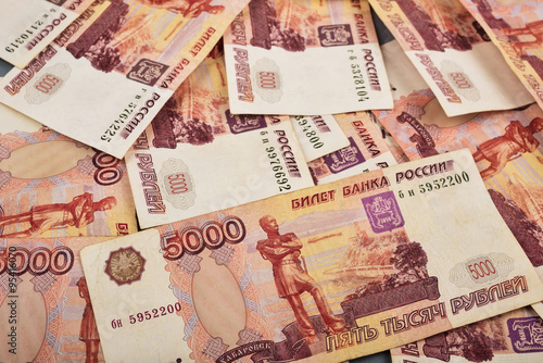 Russian rubles are laid out on a gray background photo