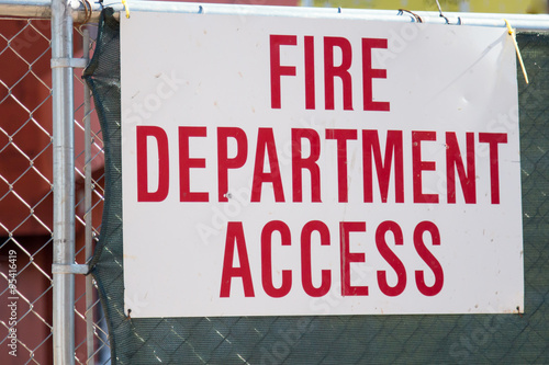 Fire Department Access sign on a fence
