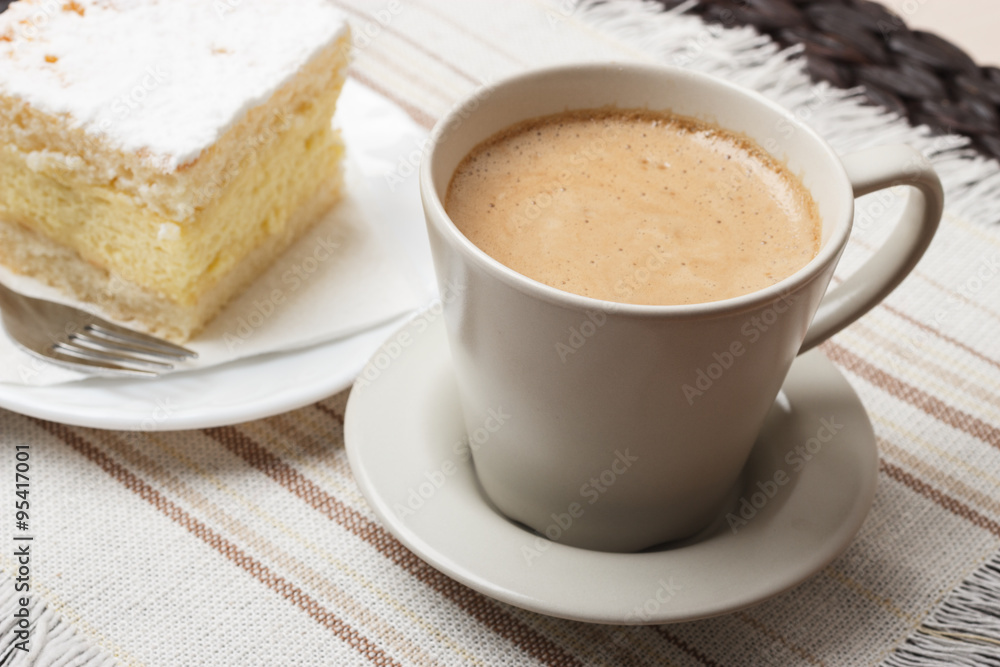 cup with coffee and cake on table cup with coffee and cake on table