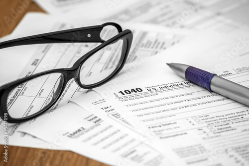 US tax form 1040 with pen and glasses