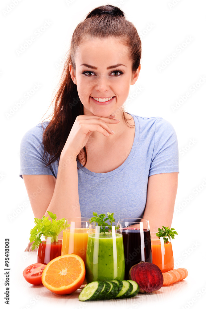 Young woman with variety of vegetable and fruit juices Young woman with variety of vegetable and fruit juices