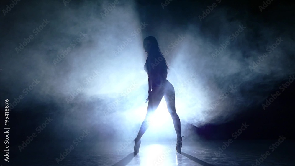 striptease dancer posing on studio background. Slow motion, smoke striptease dancer posing on studio background. Slow motion, smoke