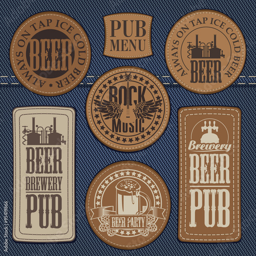 set of leather labels on denim on the theme pub with live music