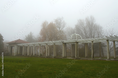 Foggy garden breezeway and gazebo photo
