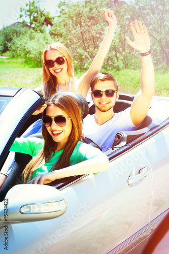 Three friends in cabriolet,...