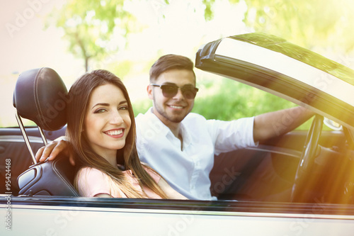 Young couple in cabriolet, ...