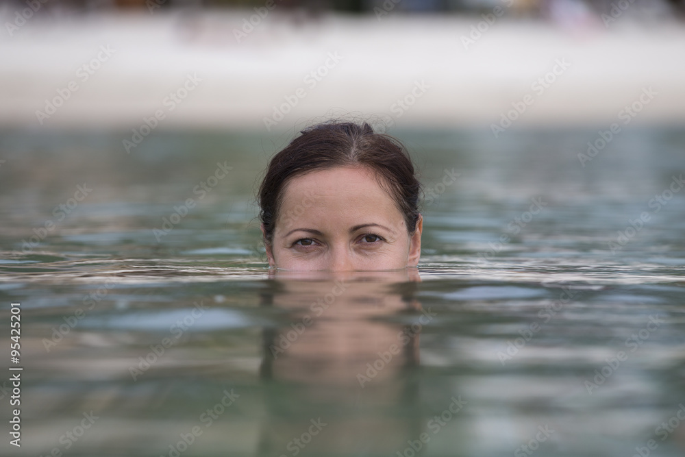 Beautiful happy woman in sea water