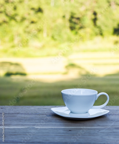 cup of morning coffee on natural outside background.