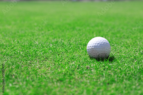 Golf ball on green golf course