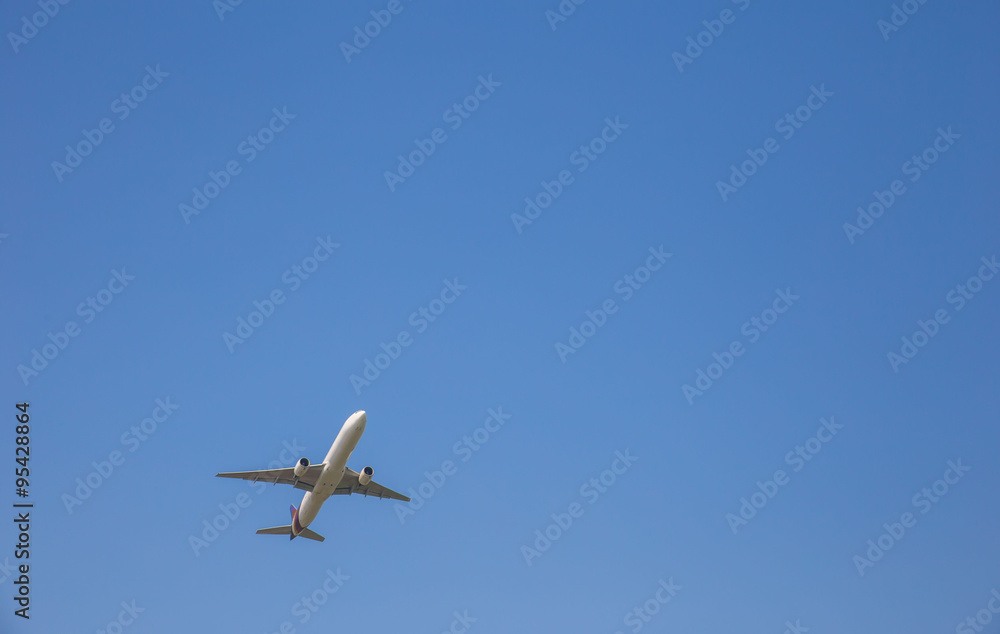 Airplane taking off at sky blue