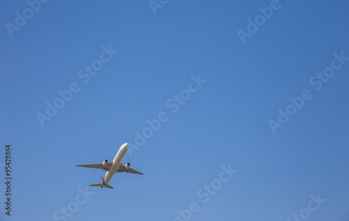 Airplane taking off at sky blue