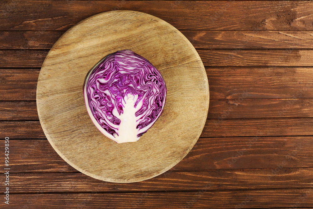 Red cabbage on wooden table