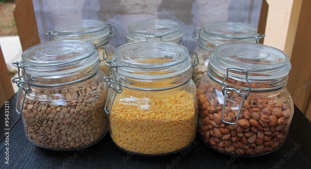 Grains and beans in glass jars in the kitchen Grains and beans in glass jars in the kitchen