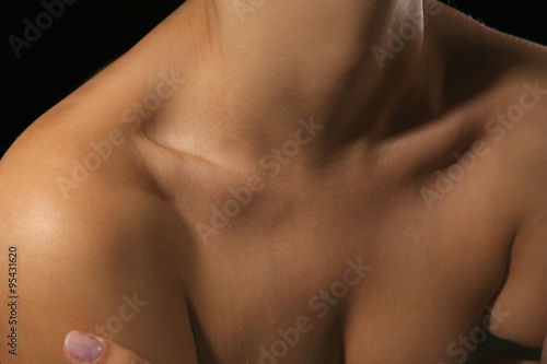 View on woman's neck, collarbone, breast and shoulders, close-up