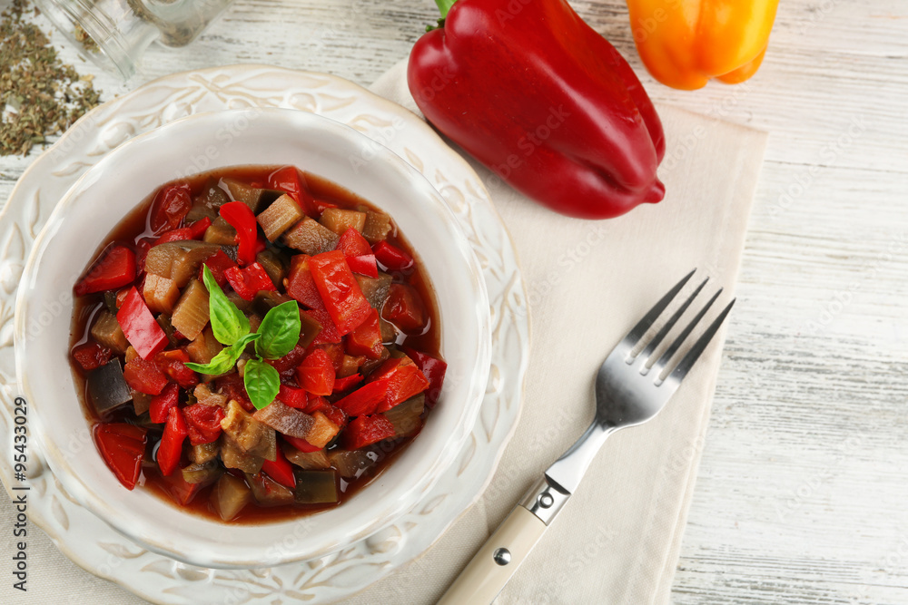 Ratatouille in bowl, on wooden table background Ratatouille in bowl, on wooden table background