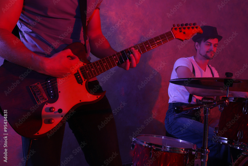 © Africa Studio - Musicians playing musical instruments in a studio