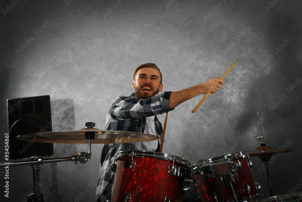 Fototapeta premium Musician playing the drums in a studio