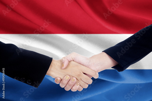 Handshake with flag of Netherlands