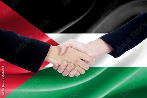 Handshake with flag of Palestine