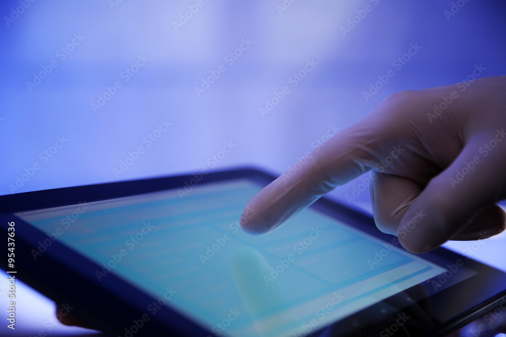 Fototapeta premium Doctor working with tablet-pc, close up