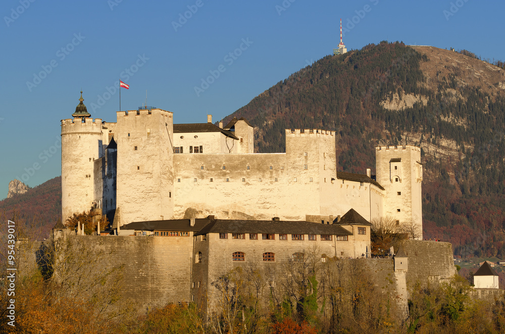 Salzburg fortress Hohensalzburg in Austria. Castle in front of Gaisberg mountain on the right and the Nockstein on the left. International festival city for classical music and birthplace of Mozart.
