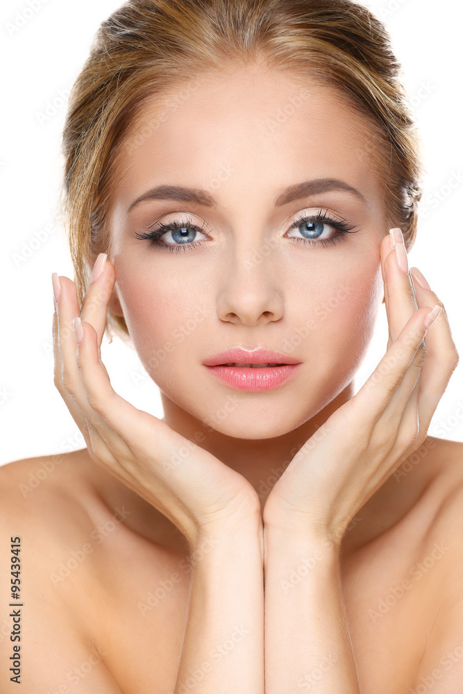 Young woman touching her face isolated on white background