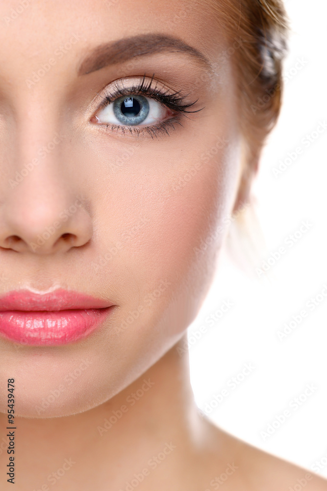 Studio shot of a beautiful young woman with perfect skin against a gray background Studio shot of a beautiful young woman with perfect skin against a gray background
