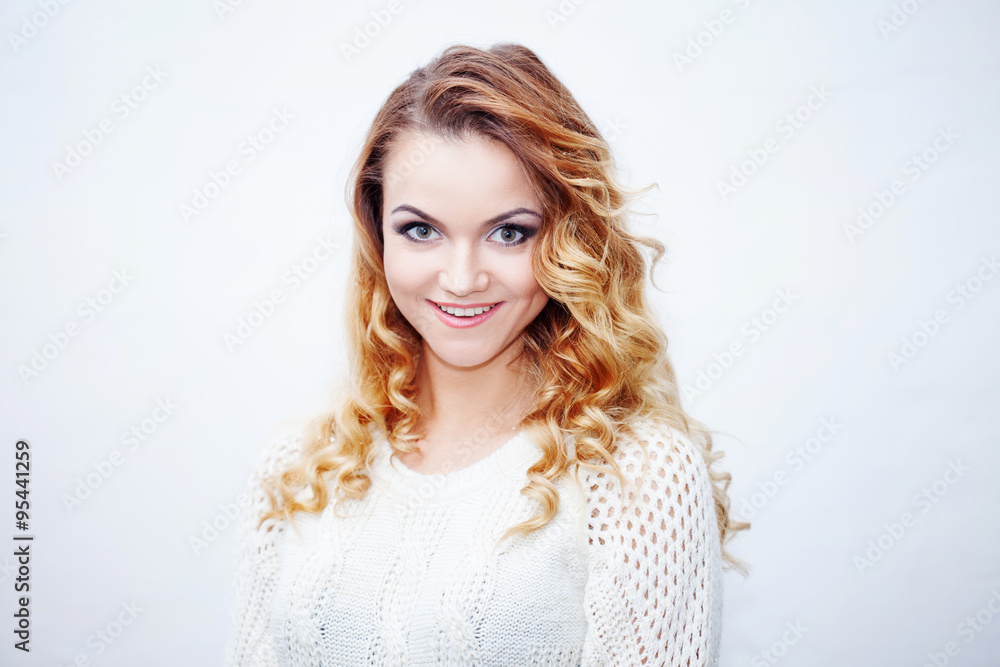 Beautiful young blonde woman, laughing and wondering, portrait on  white background