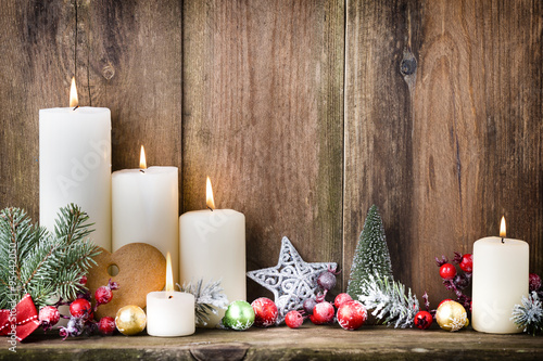 Christmas Advent candles with festive decor. photo