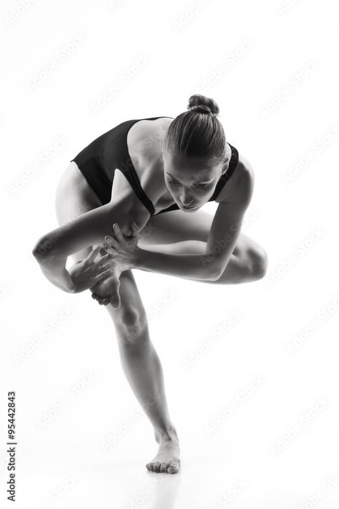 Obraz premium Modern ballet dancer posing on white background