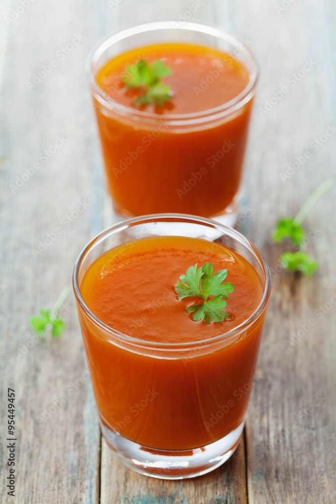 Fresh carrot juice in glass on wooden table, healthy vegetable drink Fresh carrot juice in glass on wooden table, healthy vegetable drink