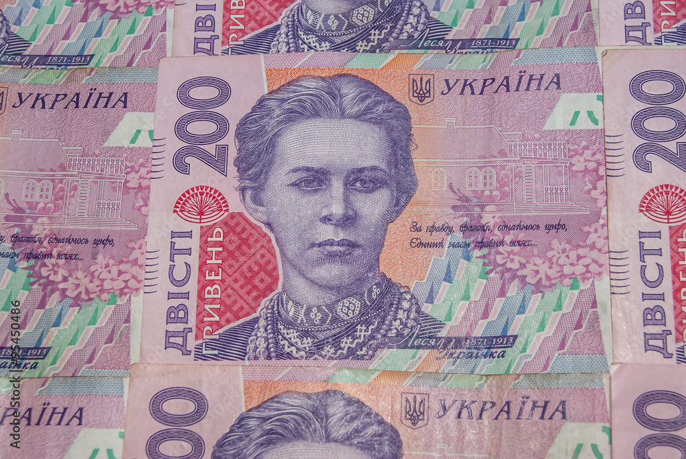 Fototapeta premium Pile of ukrainian money hryvnia, denomination of 200 UAH